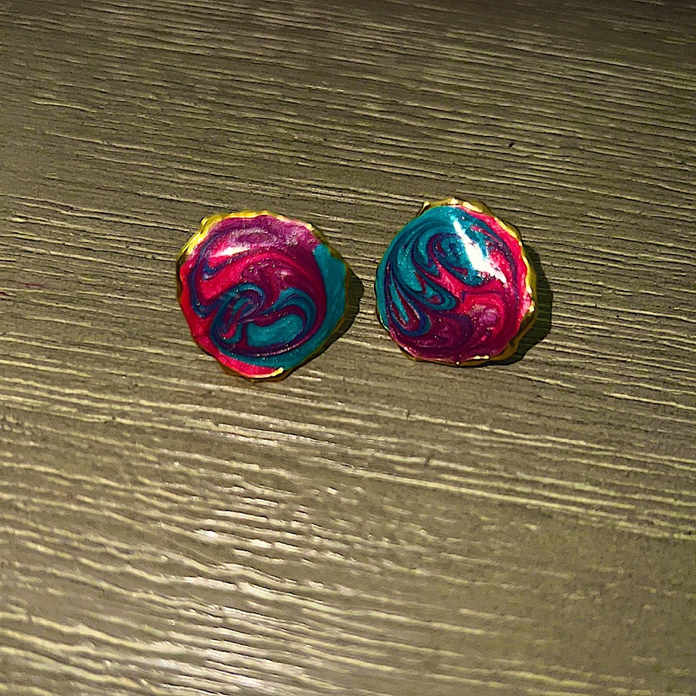 Earrings - gold plate with pink and blue marble paint design on them.